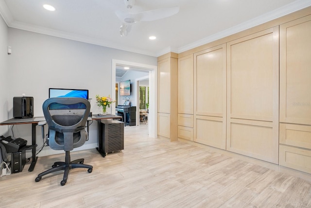 home office featuring crown molding and light hardwood / wood-style floors