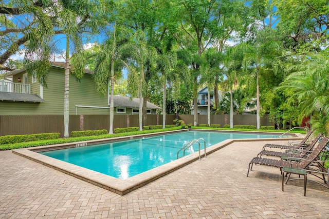 view of swimming pool featuring a patio area