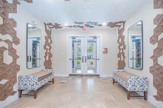 tiled foyer featuring french doors