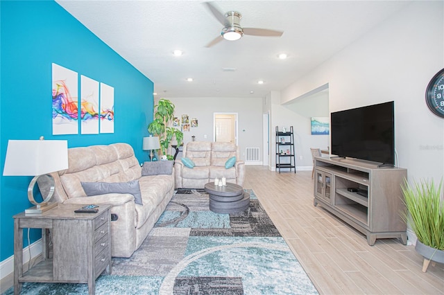 living room featuring ceiling fan and light wood-type flooring