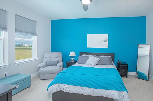 bedroom featuring ceiling fan and carpet floors