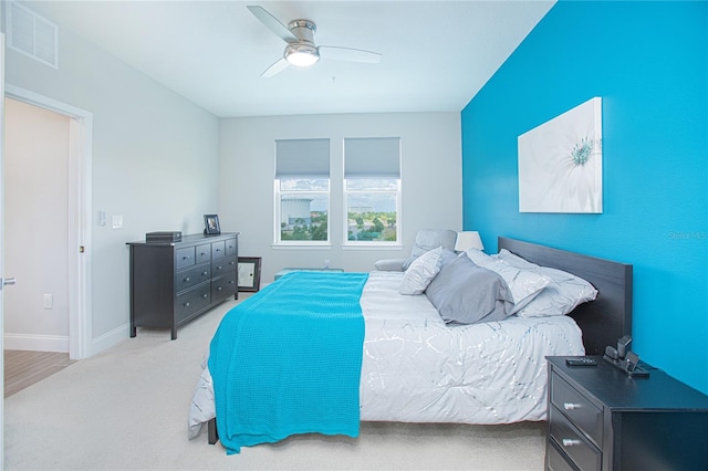 carpeted bedroom with ceiling fan