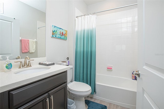 full bathroom featuring wood-type flooring, toilet, oversized vanity, and shower / bath combo with shower curtain