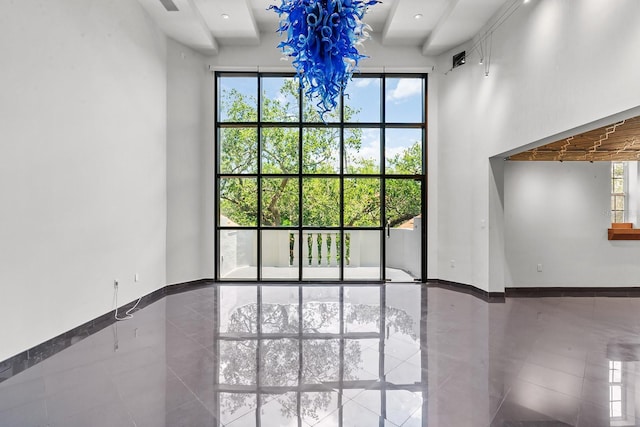 interior space featuring tile patterned flooring and beamed ceiling