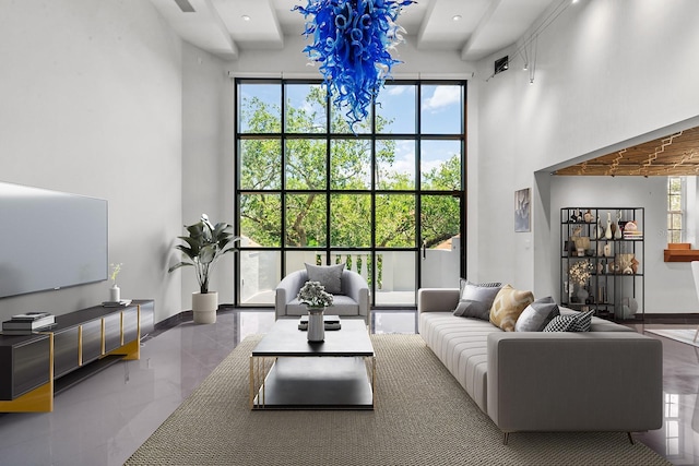 tiled living room featuring a towering ceiling