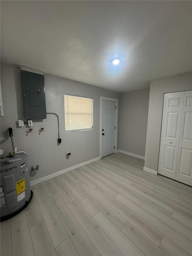 interior space with water heater and light hardwood / wood-style floors