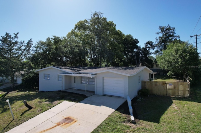 single story home with a front yard and a garage