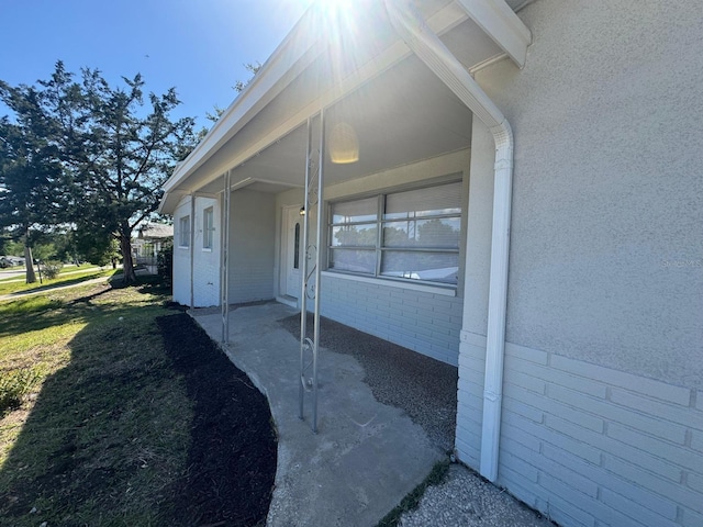 view of property exterior featuring a lawn