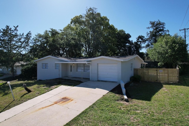 ranch-style home with a garage and a front yard