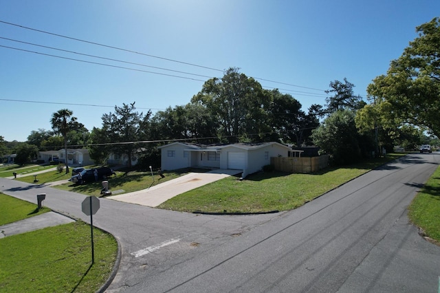 single story home with a garage and a front yard