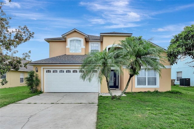 view of front of home with a front lawn, a garage, and central AC unit