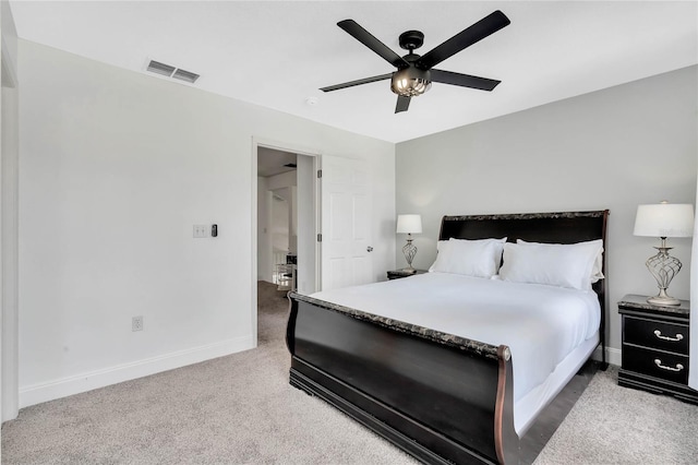 bedroom with ceiling fan and light carpet