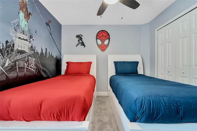 carpeted bedroom featuring a closet and ceiling fan