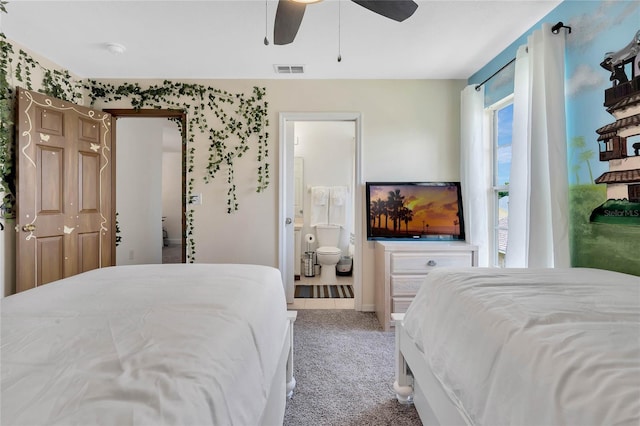 carpeted bedroom featuring connected bathroom and ceiling fan