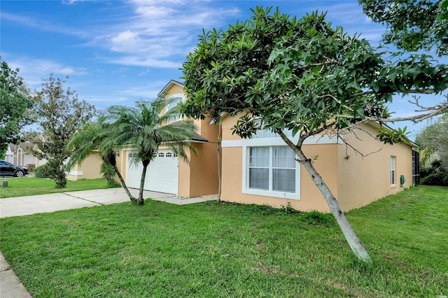 view of front of home with a garage and a front yard