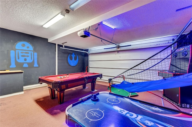 game room featuring a textured ceiling, pool table, and carpet flooring