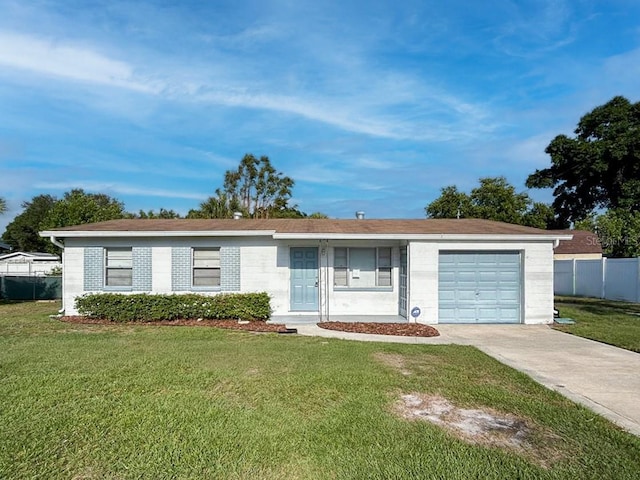 ranch-style home with a garage and a front yard