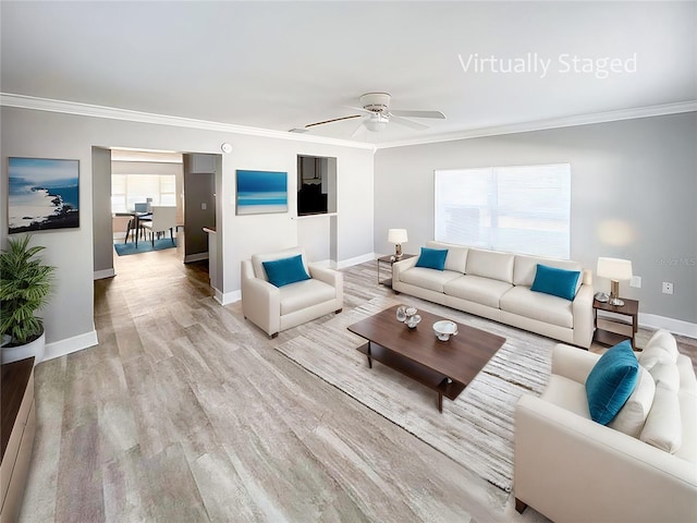 living room featuring ceiling fan, crown molding, and hardwood / wood-style flooring