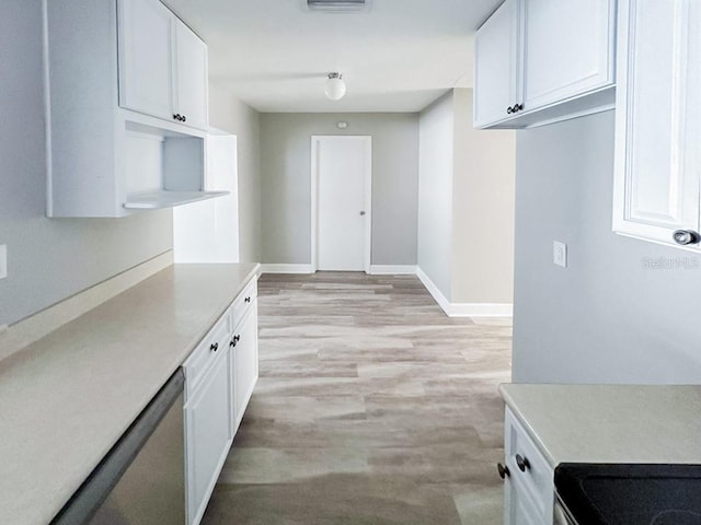 kitchen with white cabinets and light hardwood / wood-style flooring