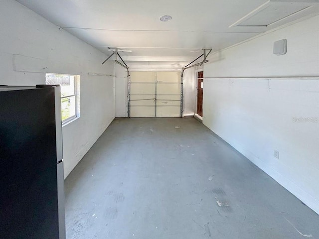 garage with stainless steel fridge