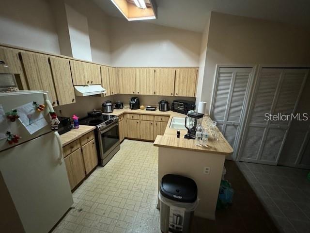 kitchen featuring light brown cabinets, butcher block countertops, white refrigerator, tile floors, and electric range