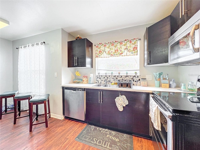 kitchen with light hardwood / wood-style floors and stainless steel appliances