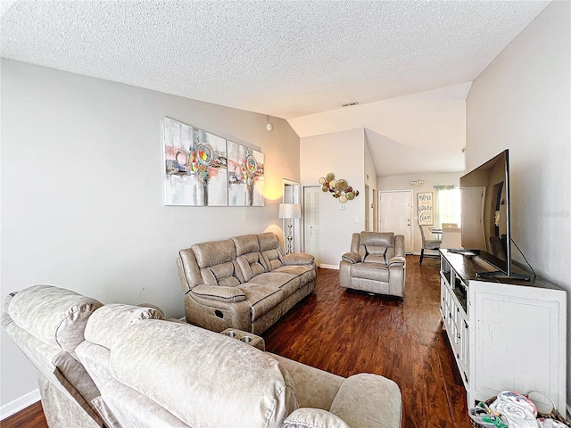 living room featuring vaulted ceiling, dark hardwood / wood-style flooring, and a textured ceiling