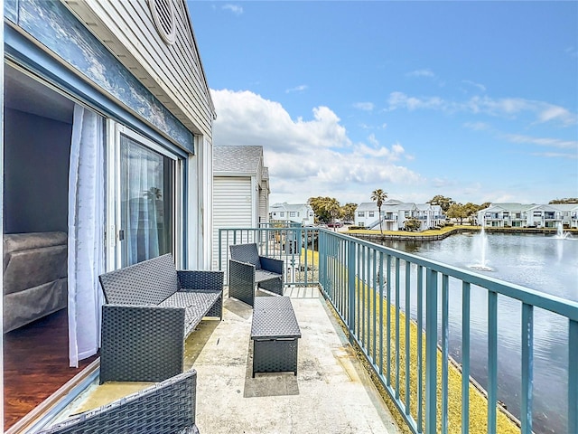 balcony featuring a water view