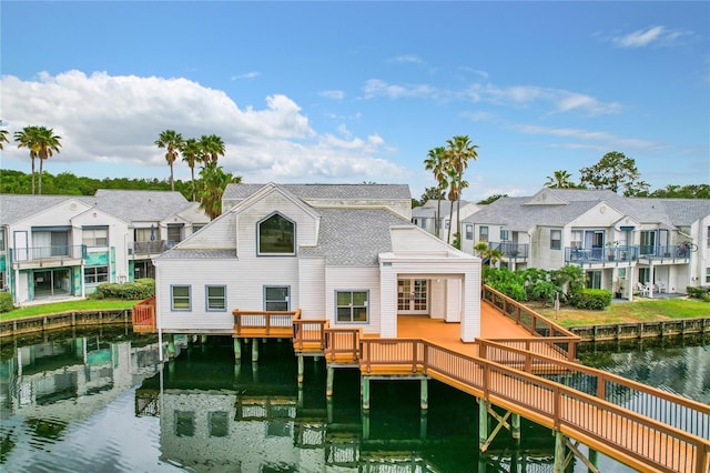 rear view of house featuring a water view