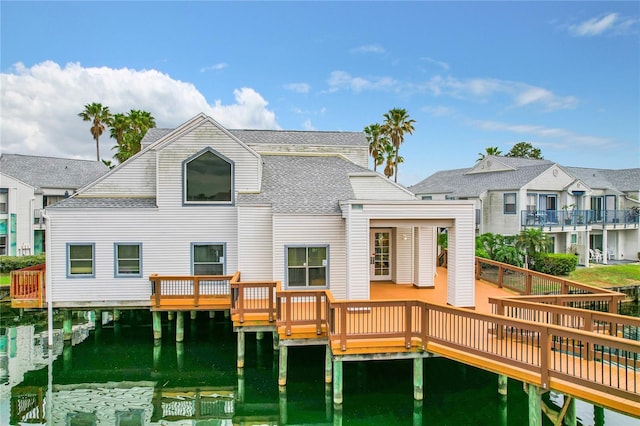 back of property featuring a deck