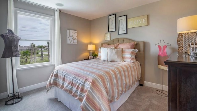 bedroom featuring light colored carpet