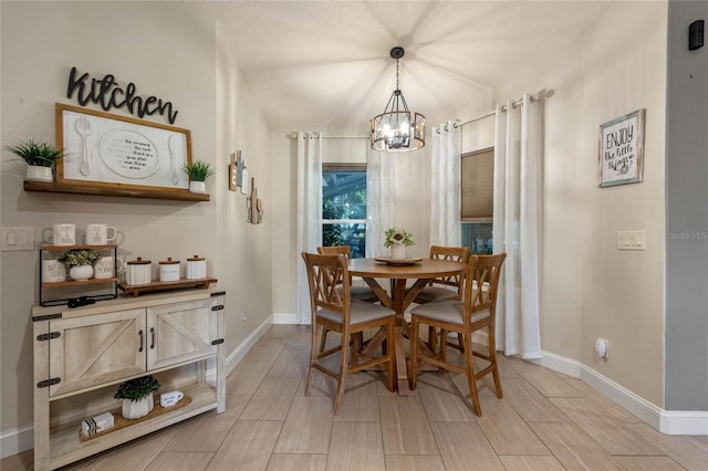 dining space featuring a chandelier