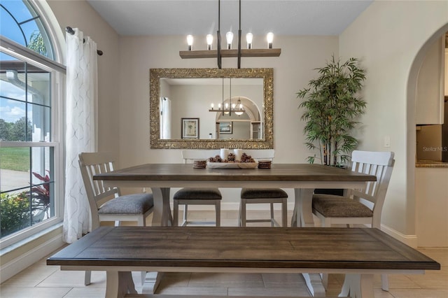 dining room with plenty of natural light and a chandelier