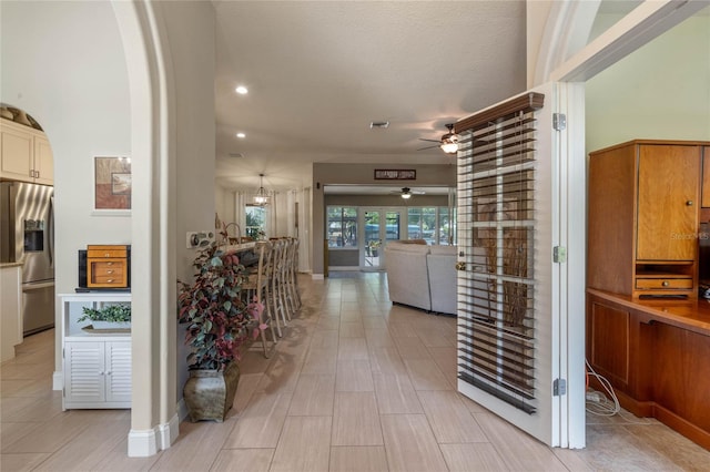 hallway featuring light tile floors