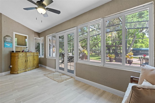 doorway to outside featuring vaulted ceiling, a wealth of natural light, and ceiling fan