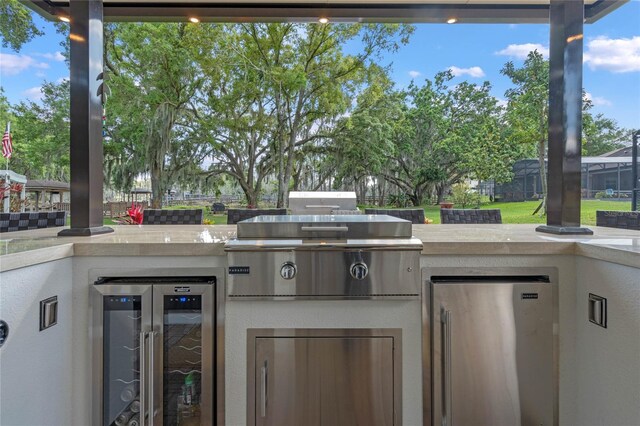 view of terrace featuring area for grilling and exterior kitchen