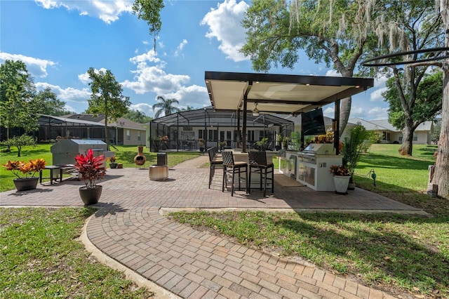 view of patio featuring area for grilling and a lanai