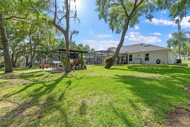 view of yard with a patio area and a lanai