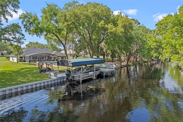 dock area with a yard and a water view