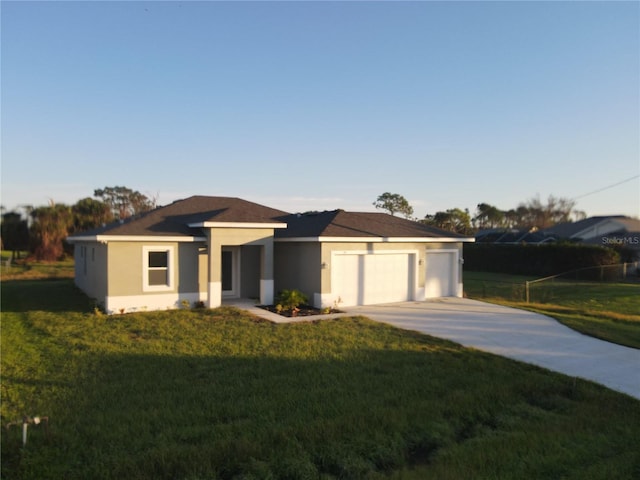 view of front of house with a front lawn and a garage