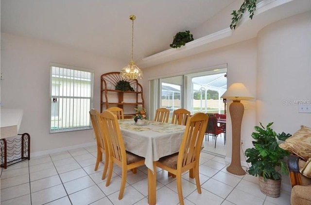 dining area with a notable chandelier, a wealth of natural light, and light tile patterned flooring