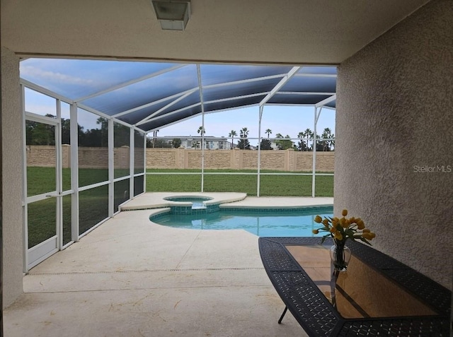 view of swimming pool with a yard, a patio, glass enclosure, and an in ground hot tub