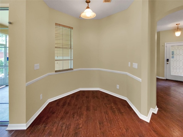 empty room featuring dark hardwood / wood-style floors