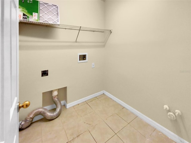 laundry area featuring gas dryer hookup, hookup for an electric dryer, tile floors, and washer hookup