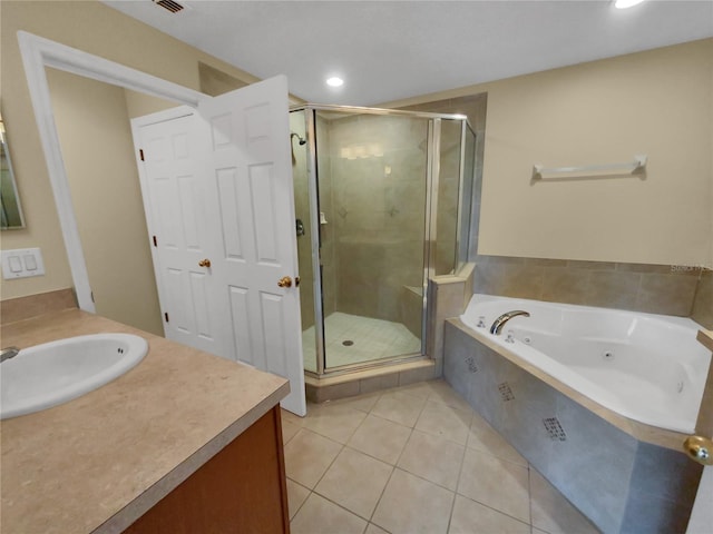 bathroom with tile flooring, vanity, and plus walk in shower