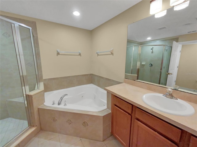 bathroom featuring tile floors, separate shower and tub, and large vanity