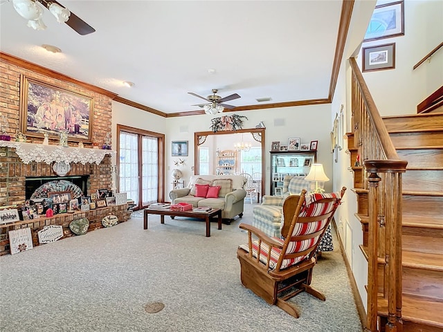 carpeted living room with a wealth of natural light, brick wall, ceiling fan, and a fireplace