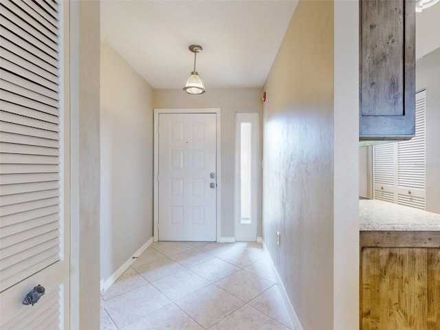 doorway to outside featuring light tile patterned floors