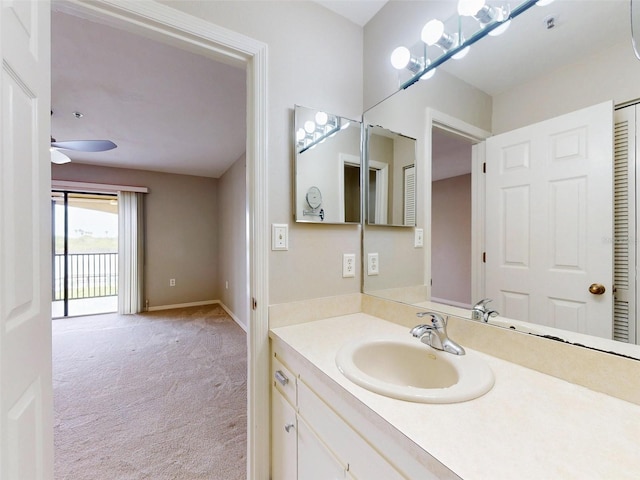 bathroom with ceiling fan and vanity