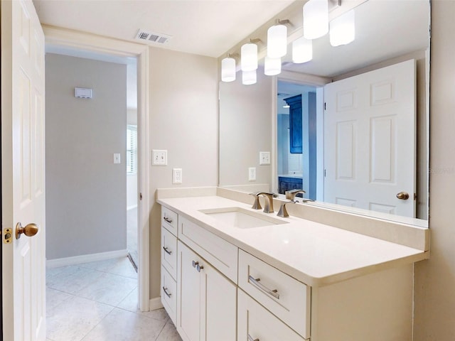 bathroom featuring tile patterned floors and vanity